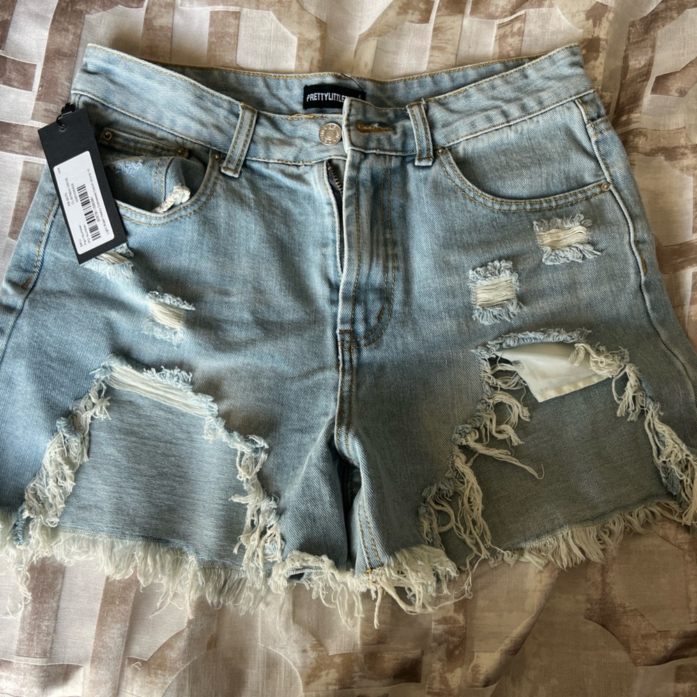 Pretty Little Thing distressed denim shorts